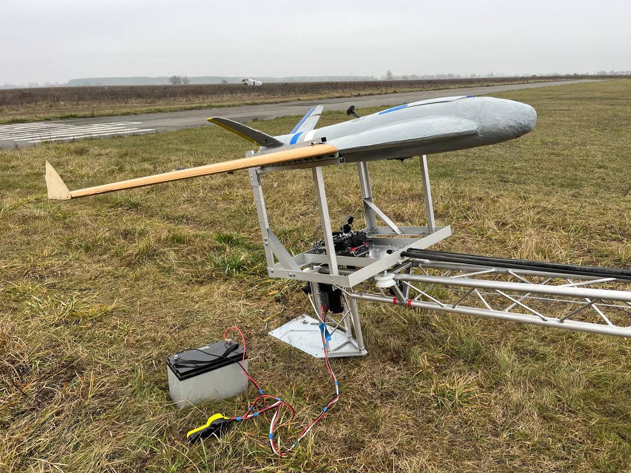 V-tail — launch-ready on catapult, nose-on angle